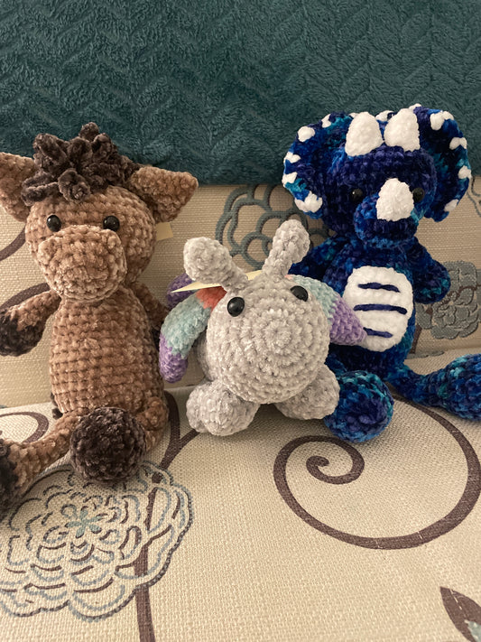Velvet stuffed animals, crocheted butterfly, dinosaur and horse