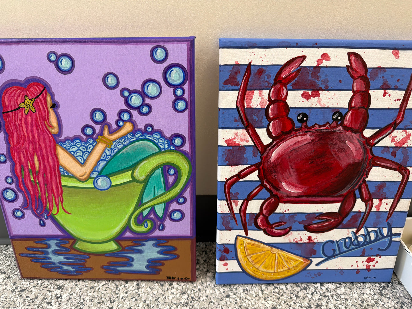 Hand painted crab and mermaid paintings by Elizabeth