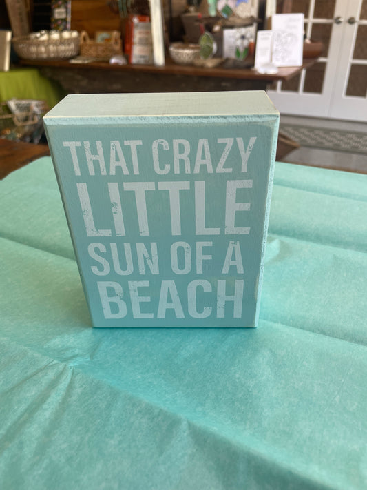 That crazy little sun of a beach wood sign